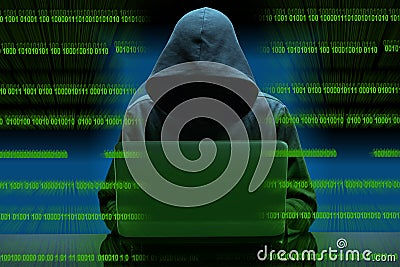 Hacker sitting at the desk with binary codes on transparency Stock Photo
