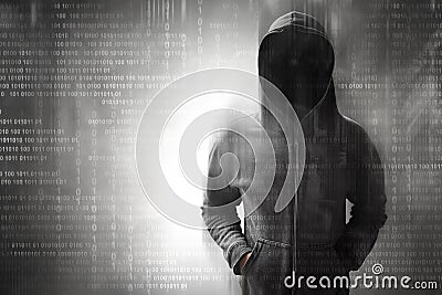 Hacker standing over on binary code Stock Photo