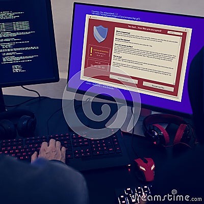Hacker trying to hack the computer system Stock Photo