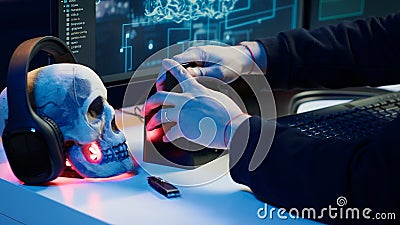 Hacker uploading script on SSD that can launch DDoS attacks on any website Stock Photo