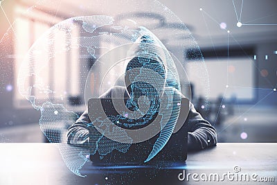 Hacker using laptop with digital globe in blurry office interior. Hacking, malware and cloud computing concept. Stock Photo