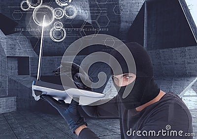 hacker using a laptop in a minimalist room Stock Photo