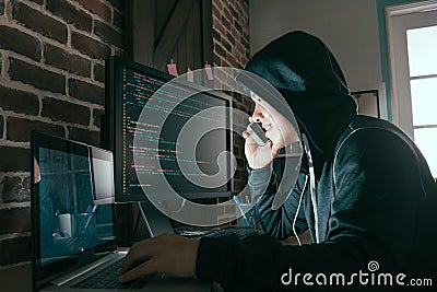 Hacker using mobile smartphone calling for victim Stock Photo
