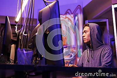 Hacker using spyware to access database Stock Photo