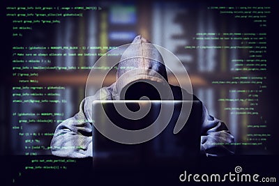 Hacker working on a computer code with laptop, double exposure with digital interface around at background. internet crime Stock Photo