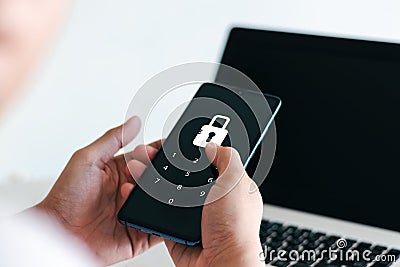 Hacking a Phishing mobile phone with a password to access a smartphone. Stock Photo