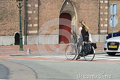 A teenage girl in bike in The Hague Editorial Stock Photo