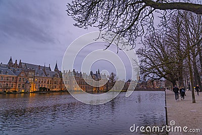 Binnenhof castle (Dutch Parliament) with the Hofvijver lake against a background of skyscrapers Editorial Stock Photo