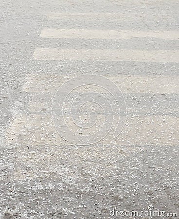Hail and rain hitting the crosswalk Stock Photo