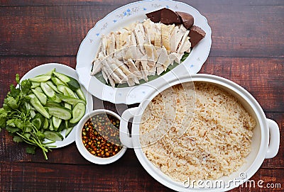 Hainanese chicken served with oily rice on the wood table Stock Photo