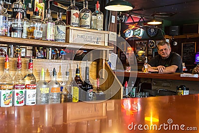 Alaskan man having a beer in Haines. Editorial Stock Photo