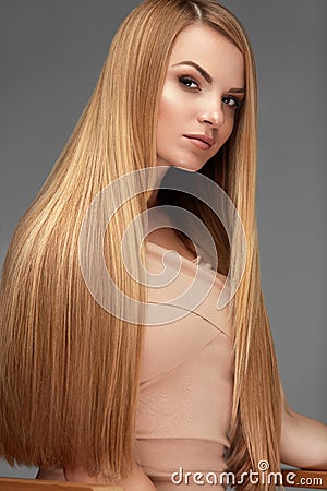 Hair Beauty. Beautiful Woman With Healthy Long Straight Hair Stock Photo