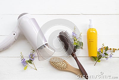 Hair care serum for damaged hairs ,dryer ,comb health care beauty head and hairs of lifestyle woman Stock Photo