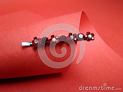 Hair clip and red paper Stock Photo