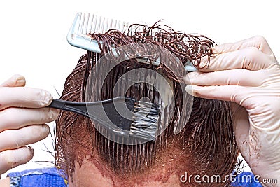 Hair coloring with their hands Stock Photo