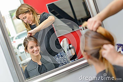 Hair dresser hard at work Stock Photo