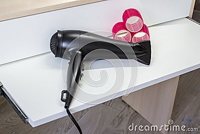 Hair dryer and curlers Stock Photo