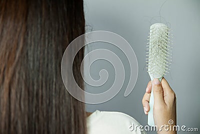 Hair loss problem. Hairs fall in comb, hair fall everyday Stock Photo