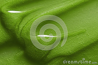 Hair mask texture. Green cosmetic conditioner smear smudge background Stock Photo