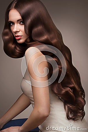 Hair. Portrait of Beautiful Woman with Long Wavy Hair. High quality image. Stock Photo