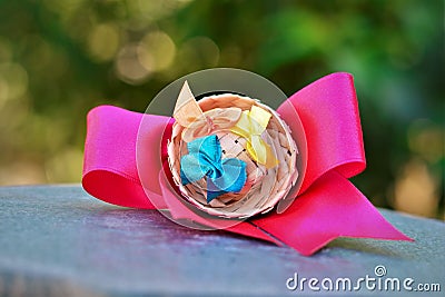 Beautiful hair ribbon with mini straw hat with colorful ribbons Stock Photo