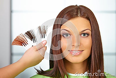 Hair salon. Woman choses color of dye. Stock Photo