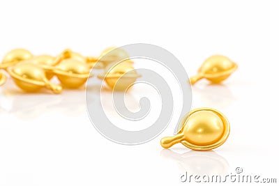 Hair vitamin serum capsule gold color. Stock Photo