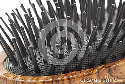 Hairbrush with plastic bristle and wooden pattern handle macro Stock Photo