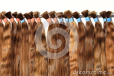 Natural, chocolate color, brown, shiny bundles of healthy hair extensions Stock Photo