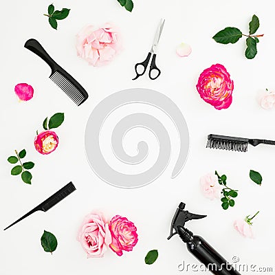 Hairdresser concept with spray, scissors, combs and pink roses flowers on white background. Flat lay, top view Stock Photo