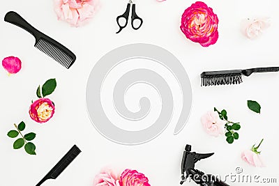 Hairdresser concept with spray, scissors, combs and roses flowers on white background. Beauty concept with copy space. Flat lay, t Stock Photo