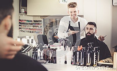 Hairdresser displaying result of work Stock Photo