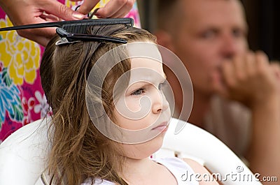 Hairdresser hands weaving a dreadlocks Stock Photo