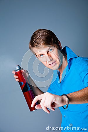 Hairdresser man with hairspray Stock Photo