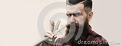 Hairdresser scissor and man retro razor. Bearded man, bearded male. Portrait of stylish man with classic long beard Stock Photo