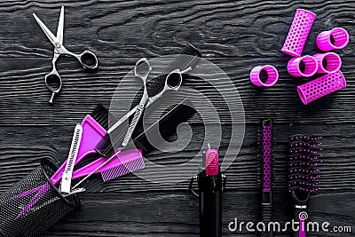 Hairdresser set on grey wooden background top view Stock Photo