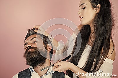 Hairdresser shears the client in the hairdresser. Hipster client visiting barber shop Stock Photo