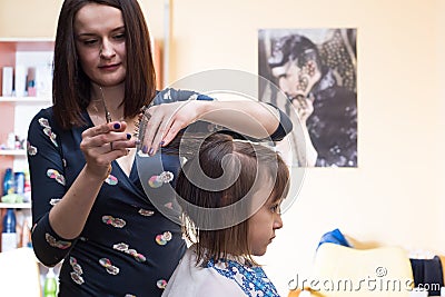 Hairdresser shears girl Stock Photo