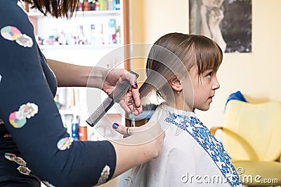 Hairdresser shears girl Stock Photo