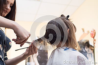 Hairdresser shears girl Stock Photo