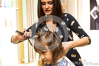 Hairdresser shears girl Stock Photo