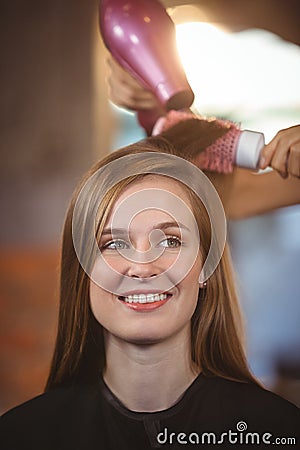 Hairdresser styling customers hair Stock Photo