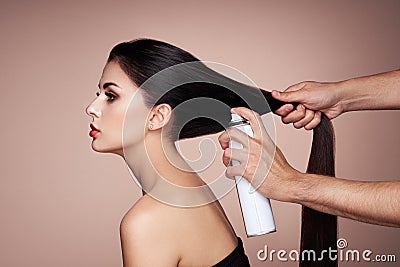 Hairdresser styling woman`s hair Stock Photo