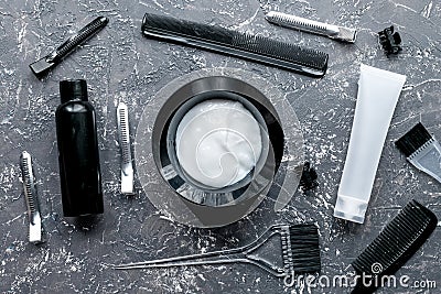 Hairdresser woorking desk with tools on gray background top view Stock Photo