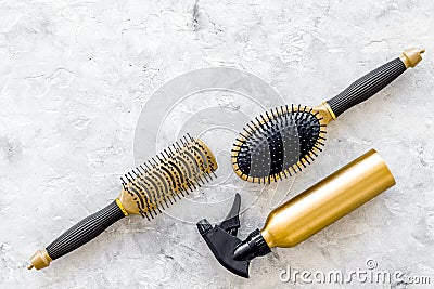 Hairdresser work with combs and brushes for styling and dyeing on stone background top view space for text Stock Photo