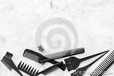 Hairdresser work desk with tools for hair styling on gray stone background top view space for text Stock Photo