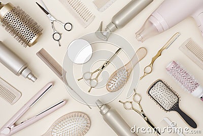 Hairdressing tools and various hairbrushes on cream background top view Stock Photo