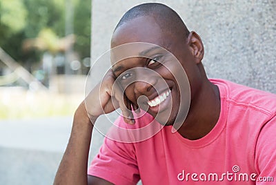 Hairless african american man laughing at camera Stock Photo