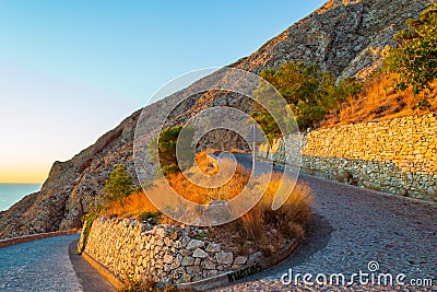 Hairpin bend at road to Mesa Vouno mountain top Santorini island Greece Stock Photo