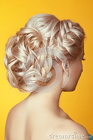 Hairstyle. Beauty Blond girl bride with curly hair styling over Stock Photo